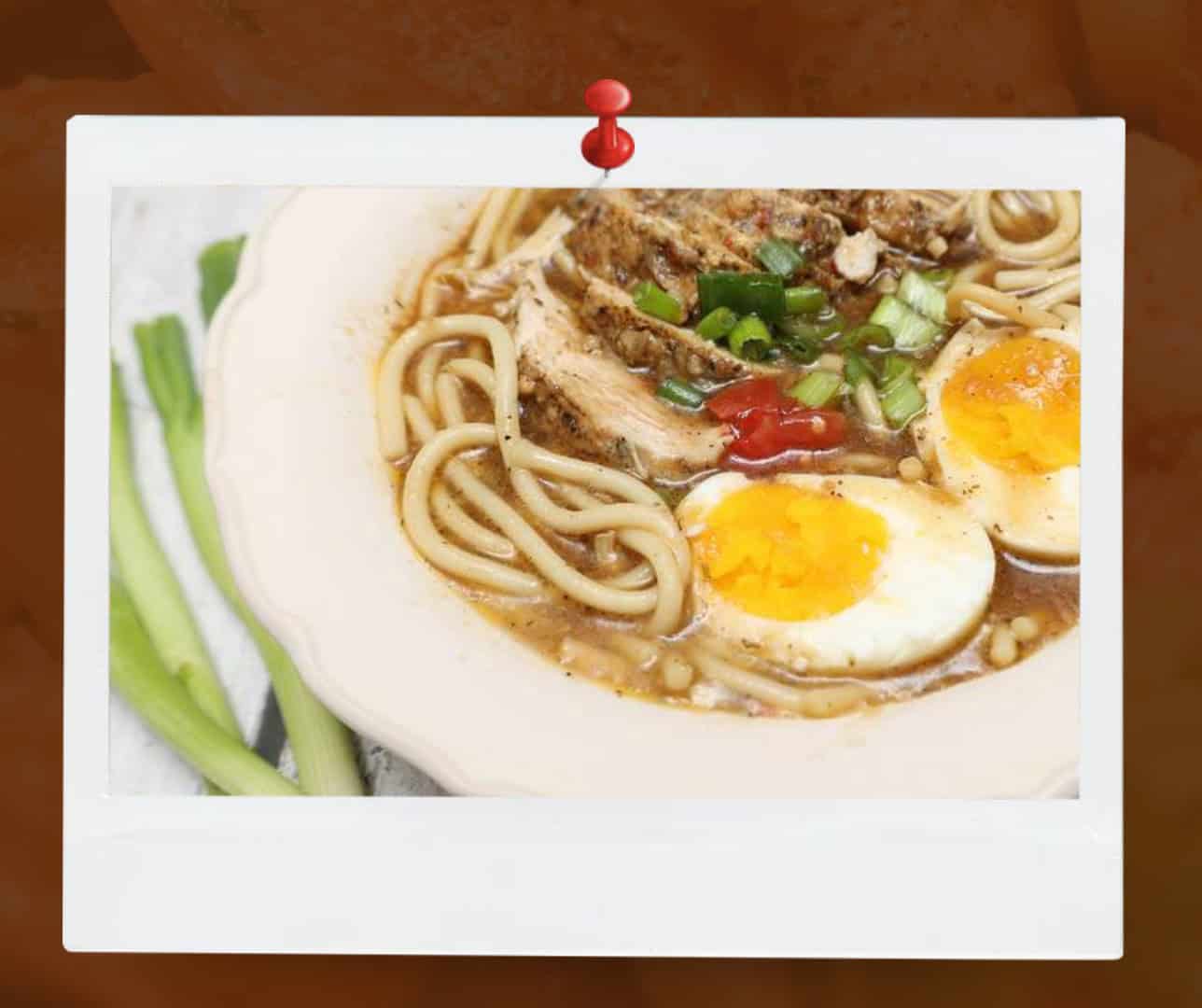 Soul food chicken yock with noodles, egg, and savory broth, reflecting African American comfort food traditions featured in The Soul Food Pot Cookbook.