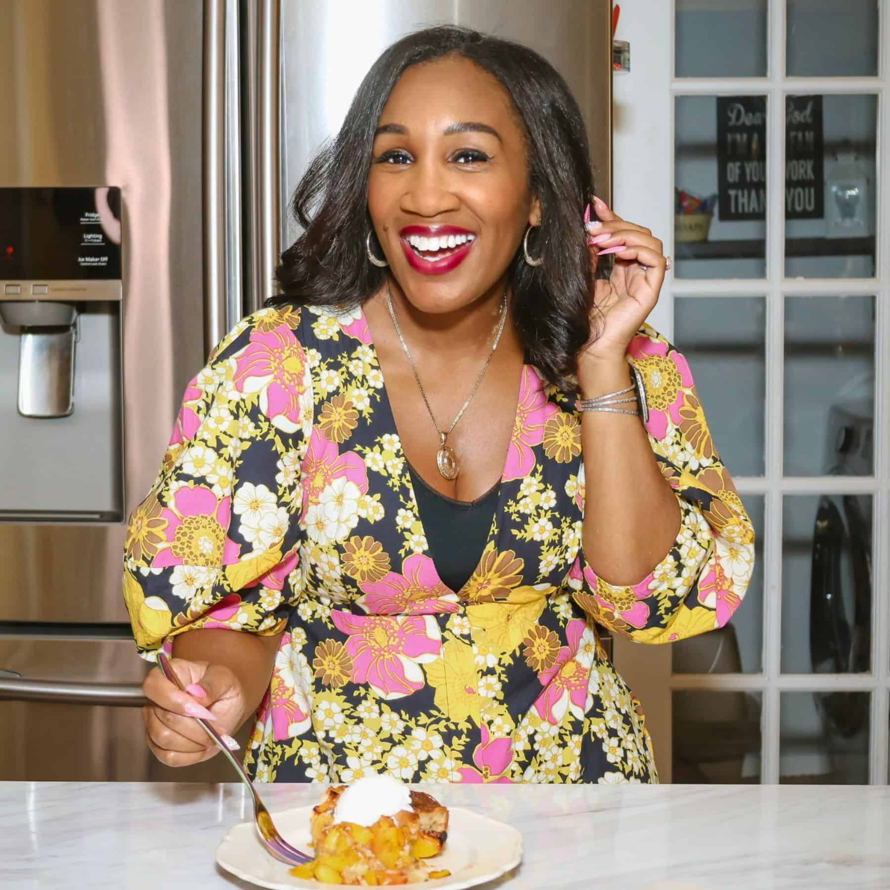 Shaunda Necole, soul food expert and author of The Soul Food Pot®, enjoying a homemade Southern dessert in her kitchen while sharing African American culinary traditions reimagined for modern cooks.