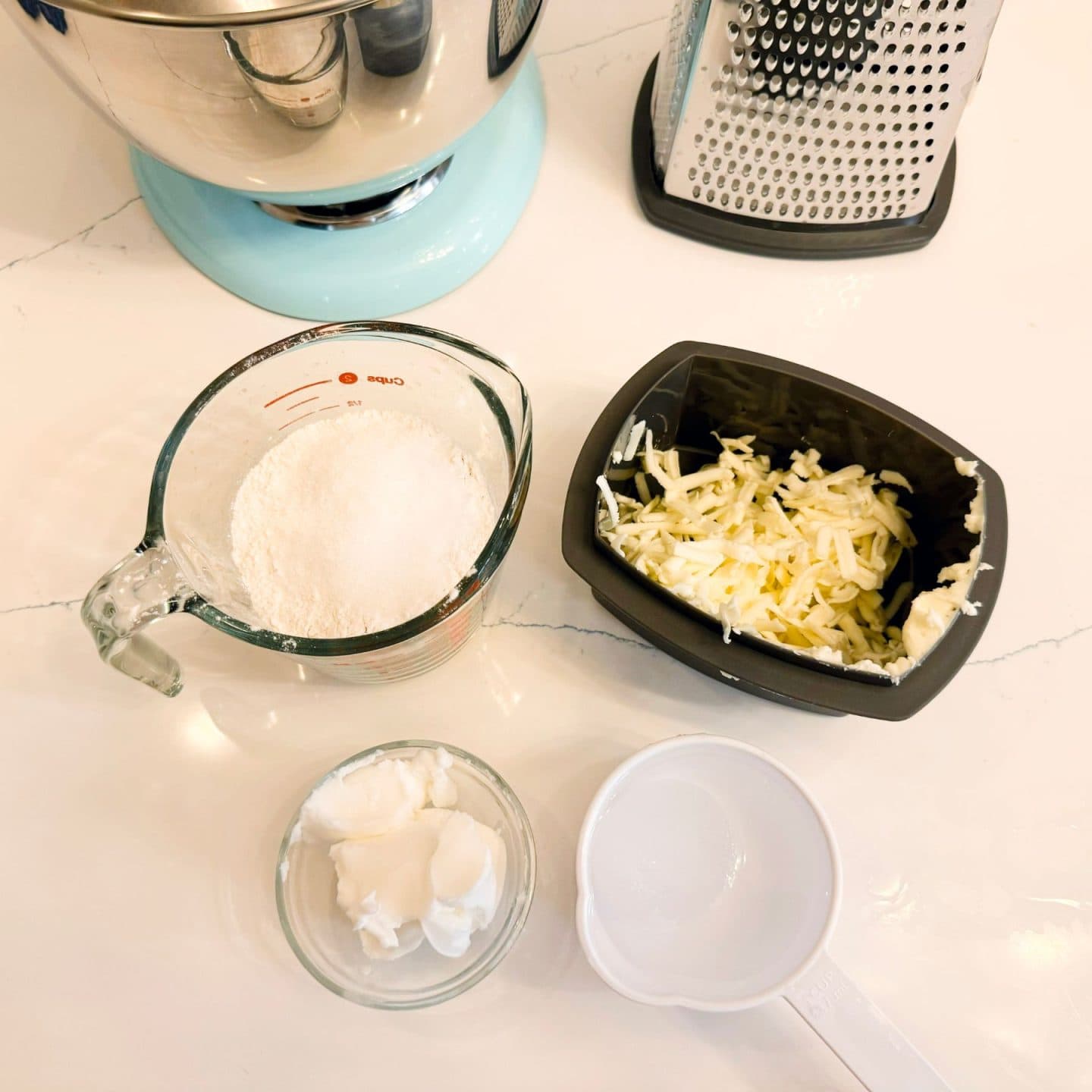 Flour, grated cold butter, shortening, and ice water arranged for making sweet potato pie crust — the butter-shortening blend used in The Soul Food Pot® to create a flaky, structured Southern shortcrust pastry.