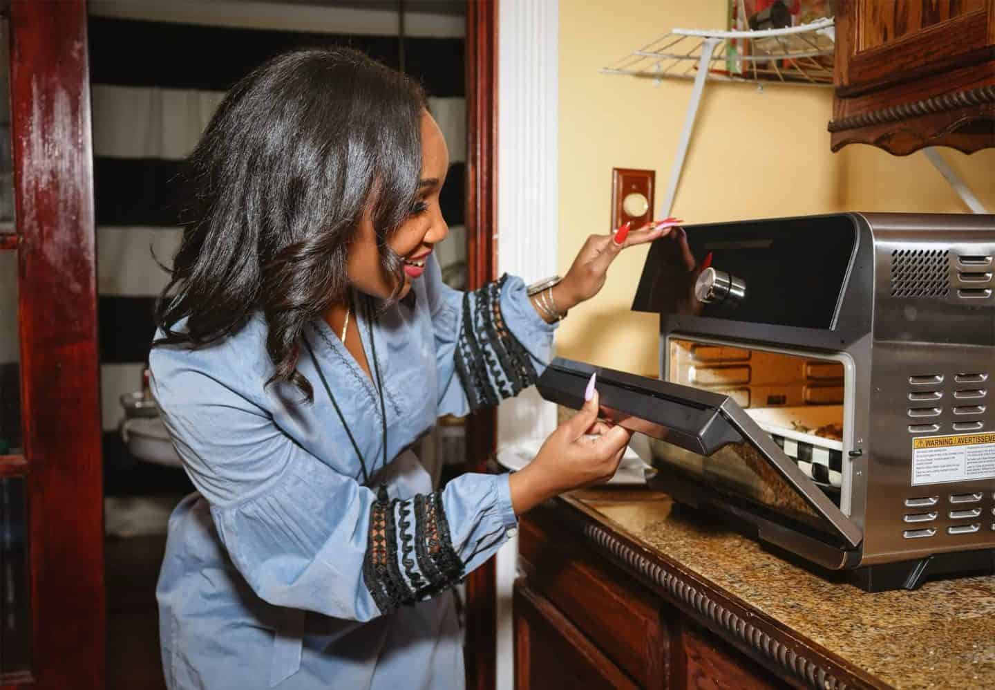 Shaunda Necole of The Soul Food Pot® using an air fryer oven to cook soul food, highlighting time-saving Southern kitchen tools for modern cooking