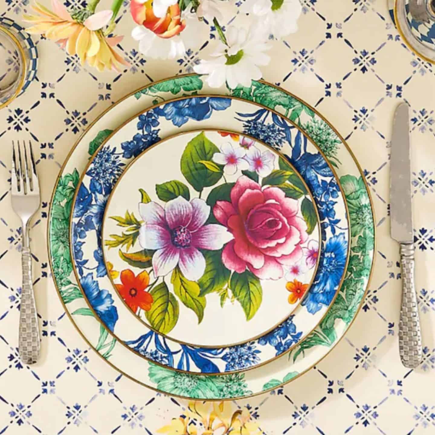 Invite nature's beauty to the table with MacKenzie-Childs floral and Courtly Check table decor.