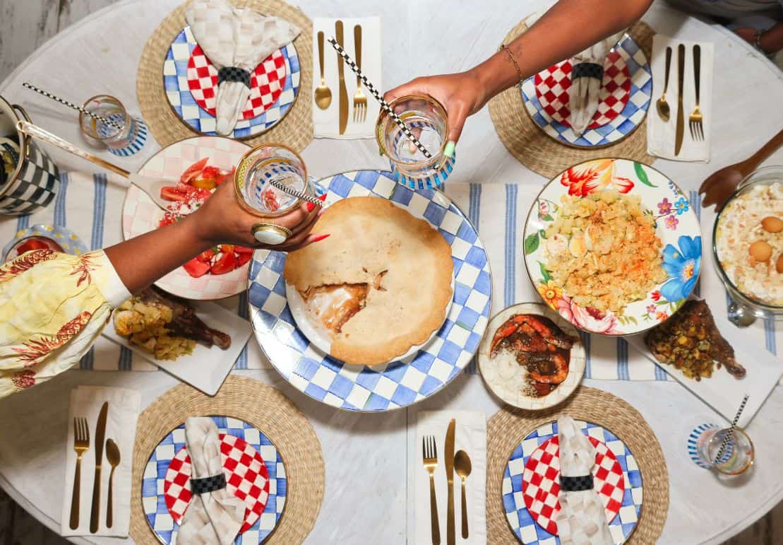 MacKenzie-Childs for Everyone - MacKenzie-Childs Courtly Check, Royal Check, and Cherry Check multi-pattern tablescape with Coastal vibes dining table, colorful place settings, and aspirational decor, styled by Shaunda Necole of The Soul Food Pot® for Southern holiday hosting inspiration
