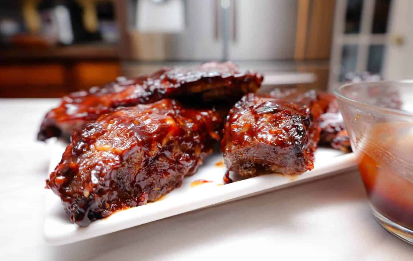 Tender air fryer BBQ ribs glazed with barbecue sauce, a Labor Day main dish from Shaunda Necole of The Soul Food Pot® and an easy alternative to grilled ribs.