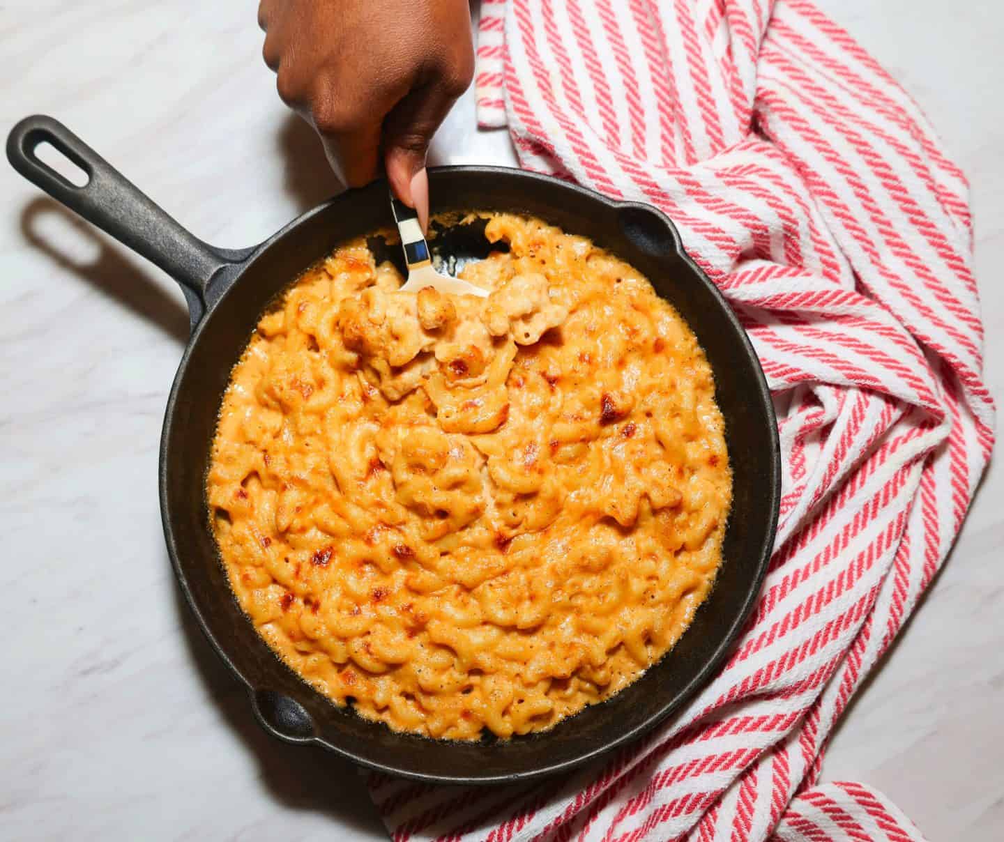Finished soul food baked mac and cheese in a cast-iron skillet