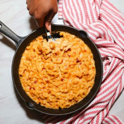 Finished soul food baked mac and cheese in a cast-iron skillet