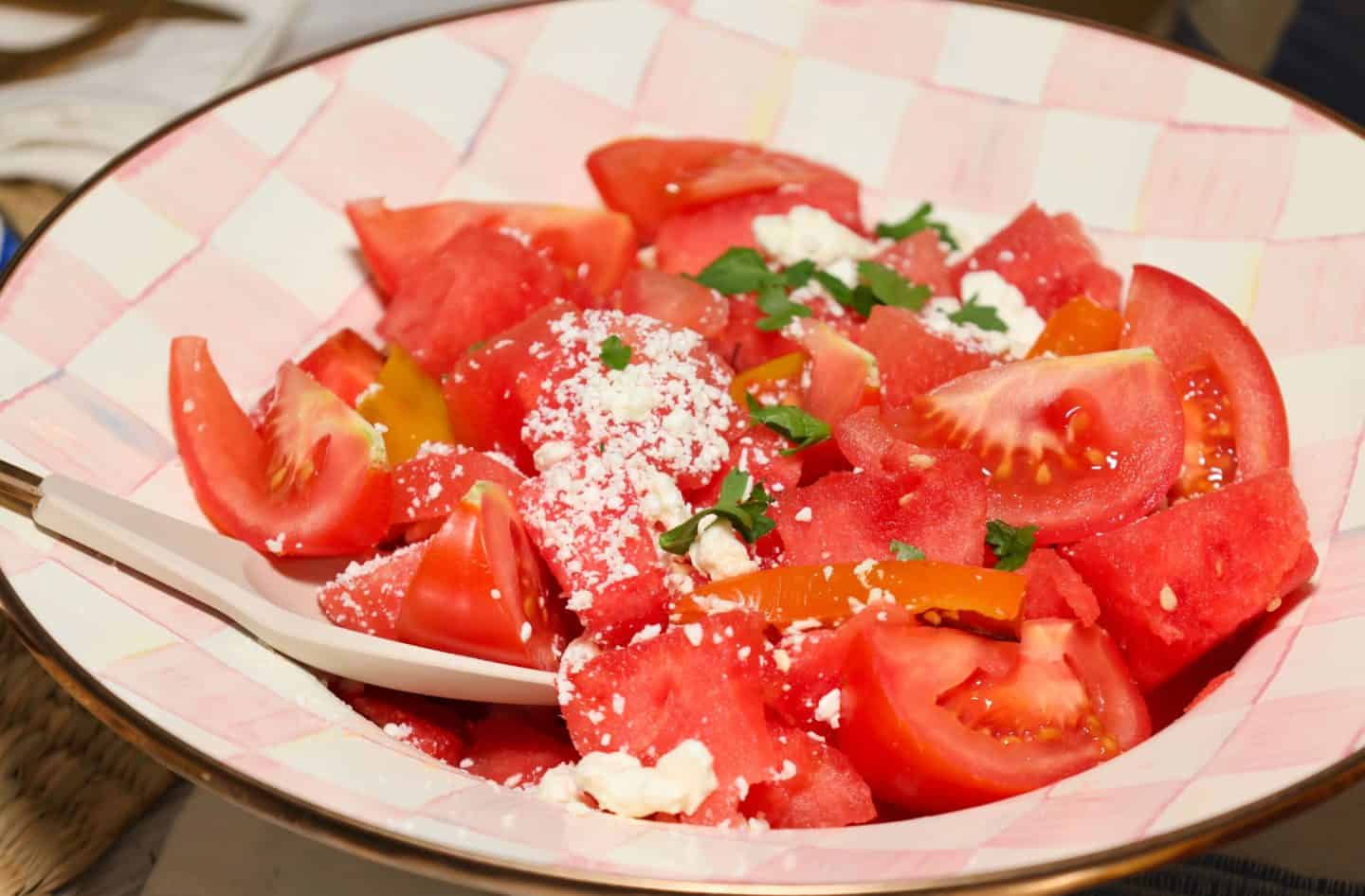 Fresh tomato watermelon salad with ripe red tomatoes, juicy watermelon, crumbled cheese, and fresh herbs, a no-cook late-summer Labor Day side from The Soul Food Pot®.