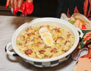Finishing potato salad with paprika