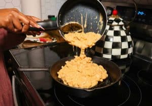 Macaroni transferring into the skillet