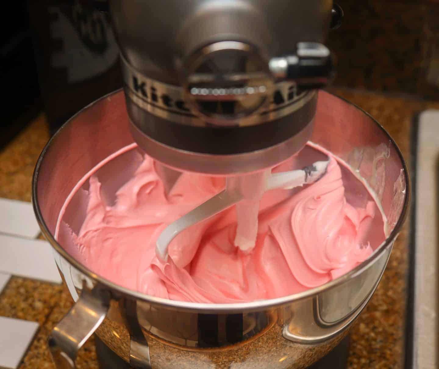 Creamy pink Black Cherry Kool-Aid pie filling mixed in a KitchenAid stand mixer for The Soul Food Pot® easy no-bake Red Kool-Aid Pie recipe.