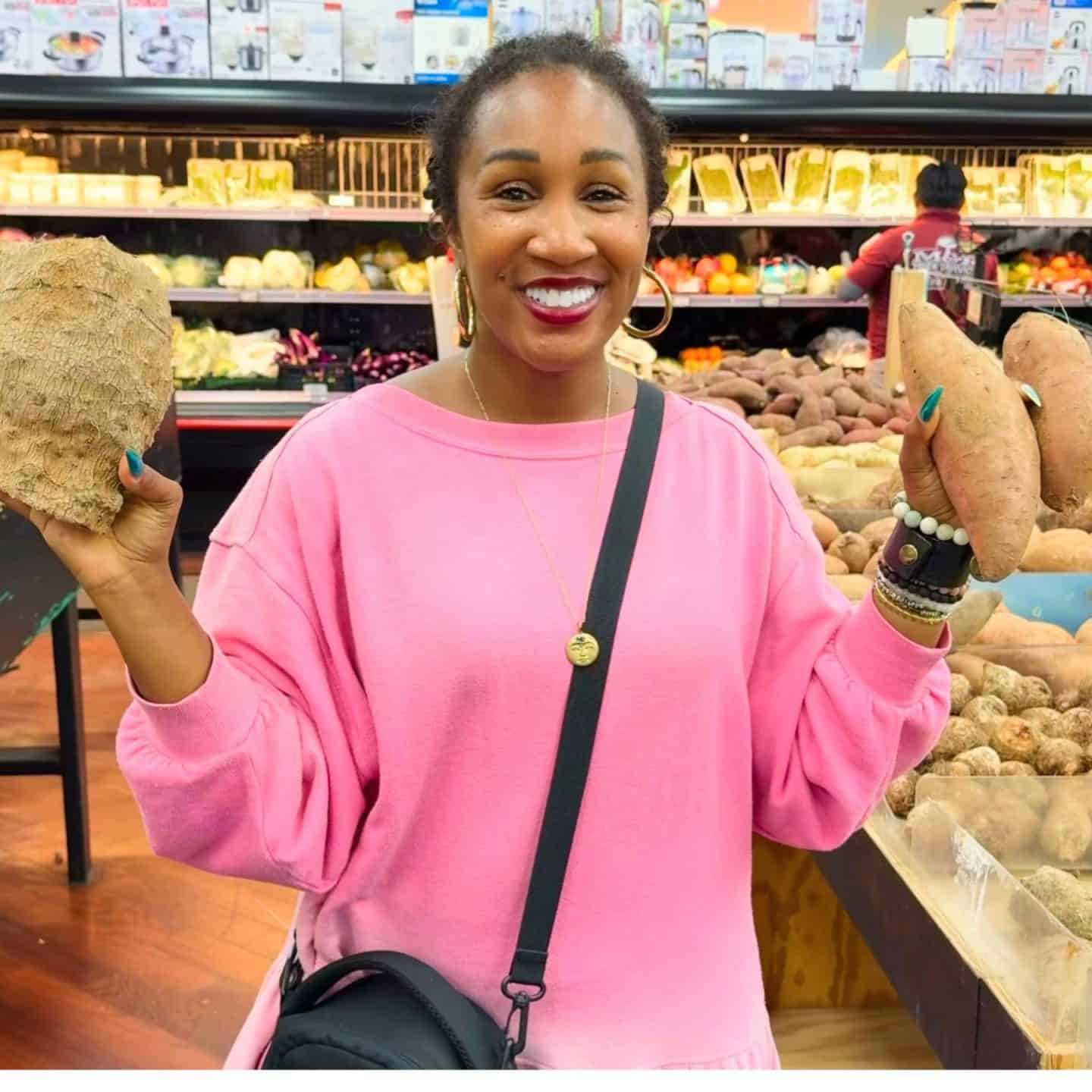 Shaunda Necole comparing a true yam with orange-fleshed sweet potatoes while grocery shopping.