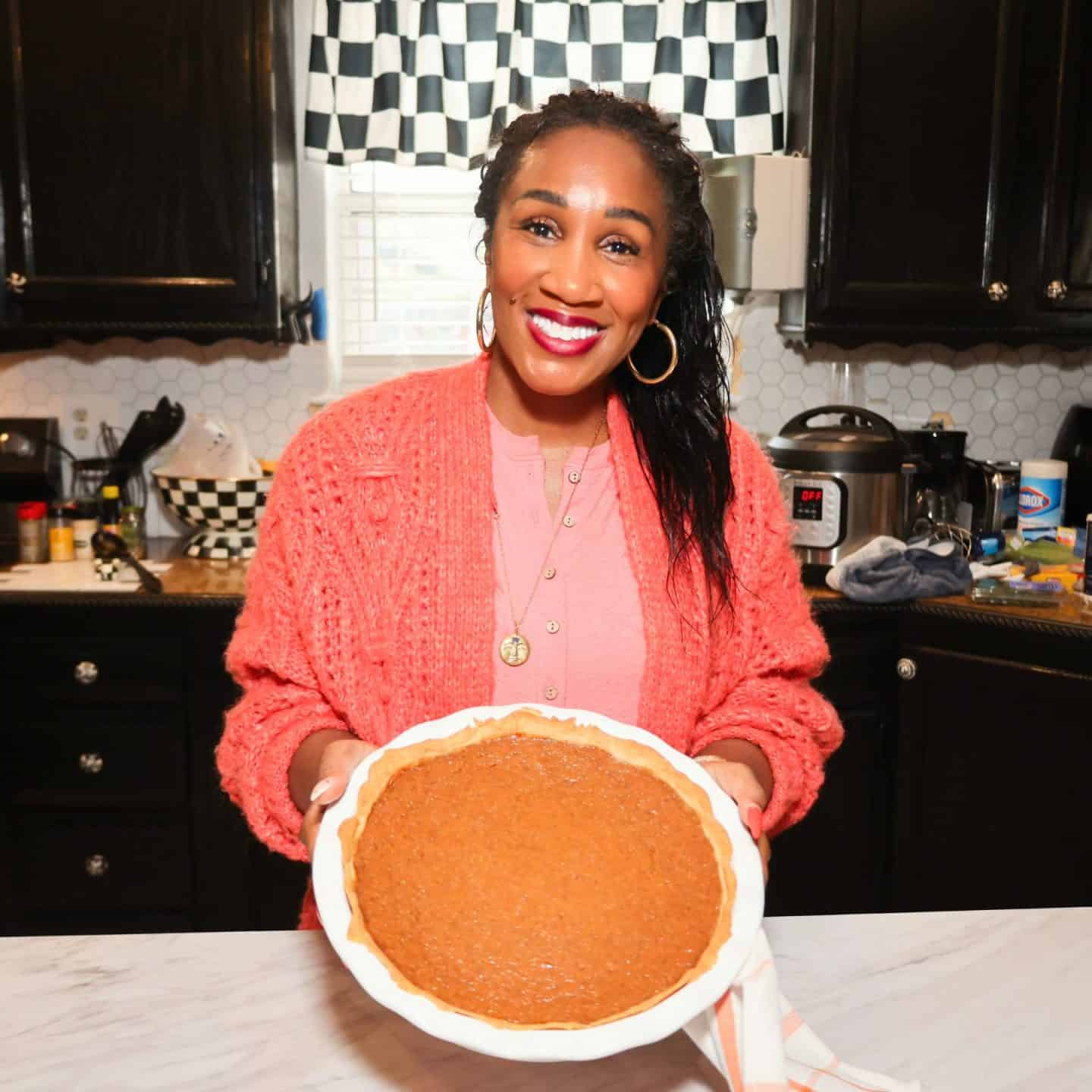 Shaunda Necole holding the finished sweet potato pie