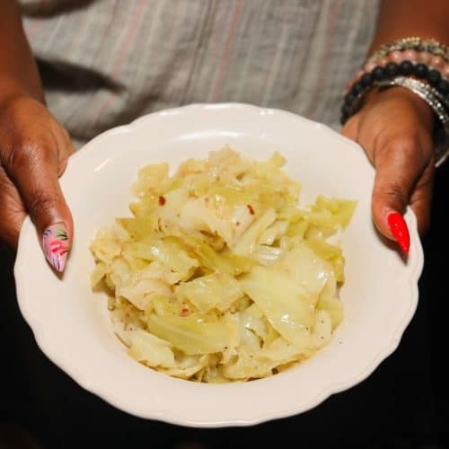 Shaunda Necole holds a bowl of tender Southern cabbage