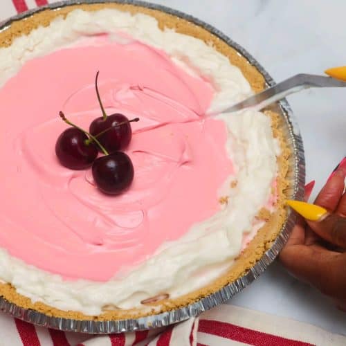 Shaunda Necole is slicing Red Kool-Aid Pie