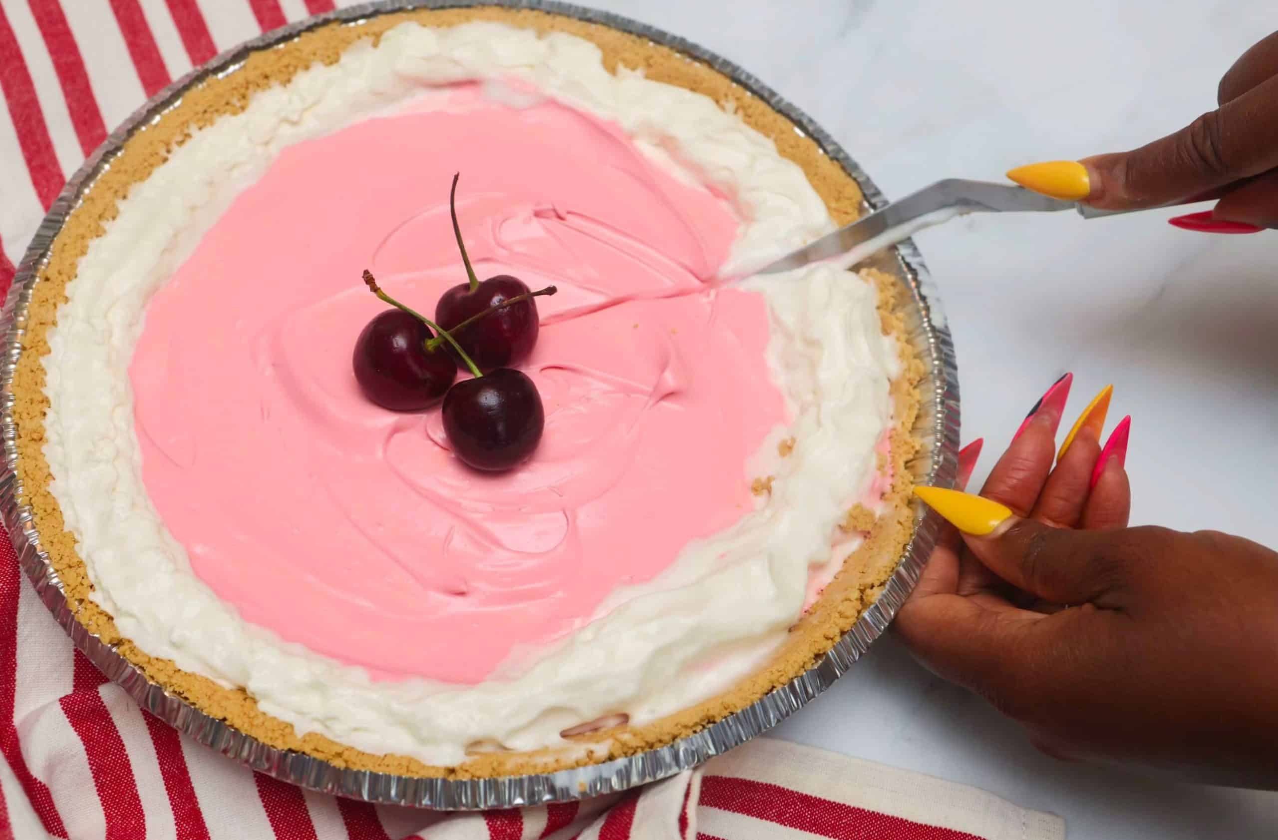 Shaunda Necole is slicing Red Kool-Aid Pie