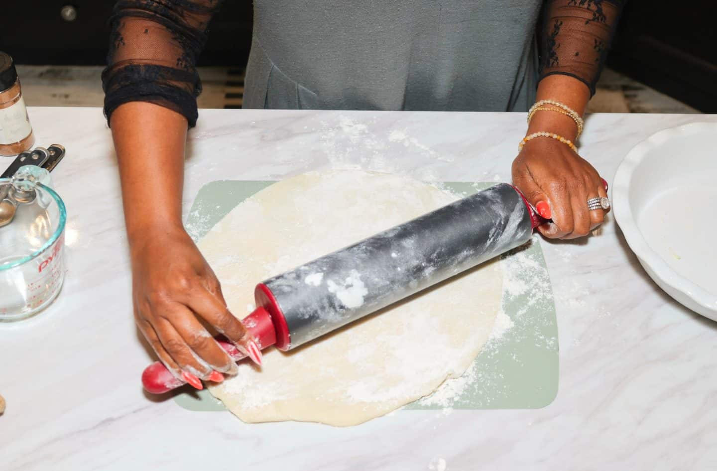 Shaunda Necole rolls homemade chicken and dumpling dough made with simple pantry staples for The Soul Food Pot®.