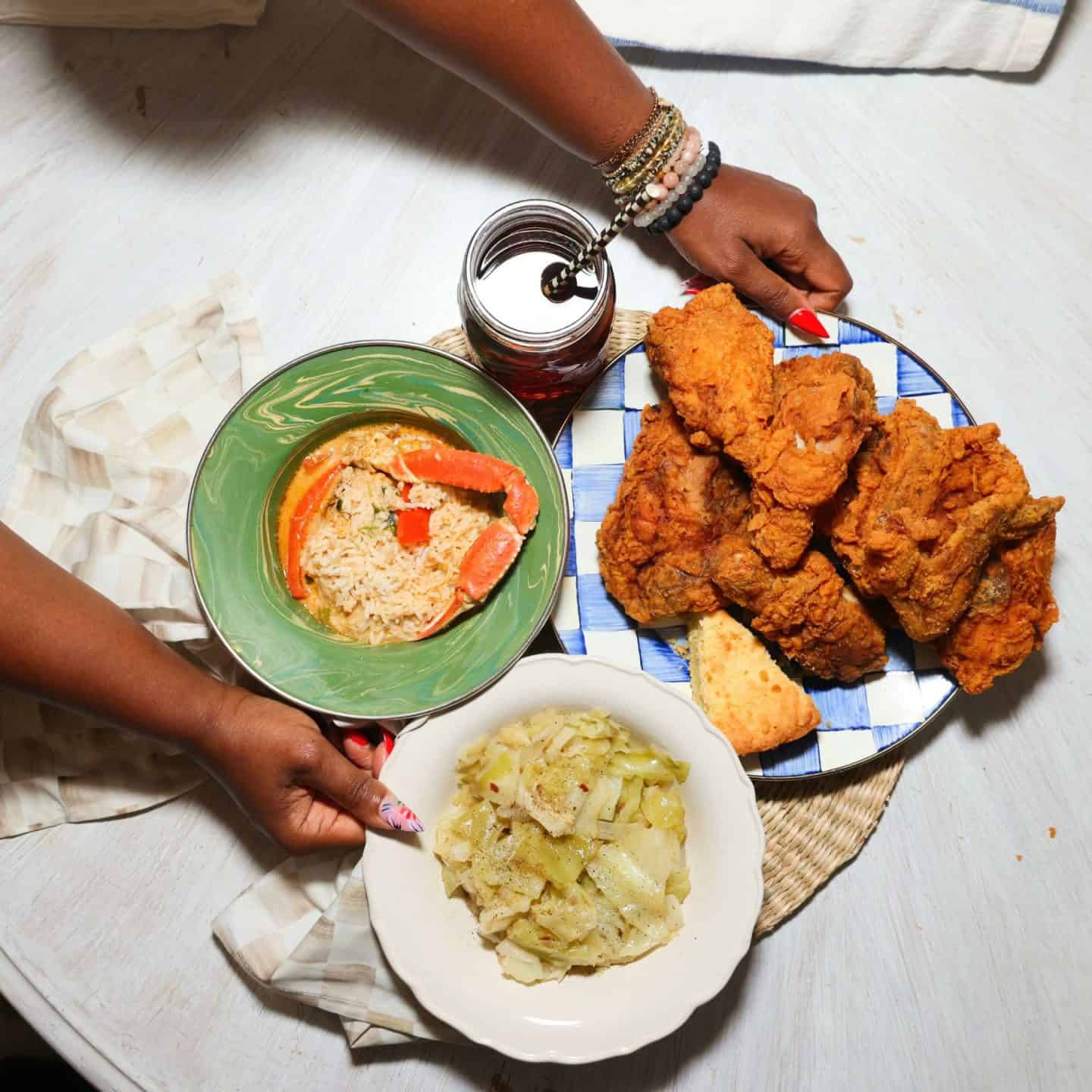 Black folks’ soul food cabbage served with Southern fried chicken, sweet tea, cornbread, and gumbo with rice for a soul food dinner — serving inspiration from The Soul Food Pot®.