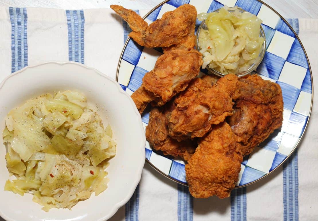 Southern cabbage served with crispy fried chicken for a classic soul food dinner from The Soul Food Pot®.