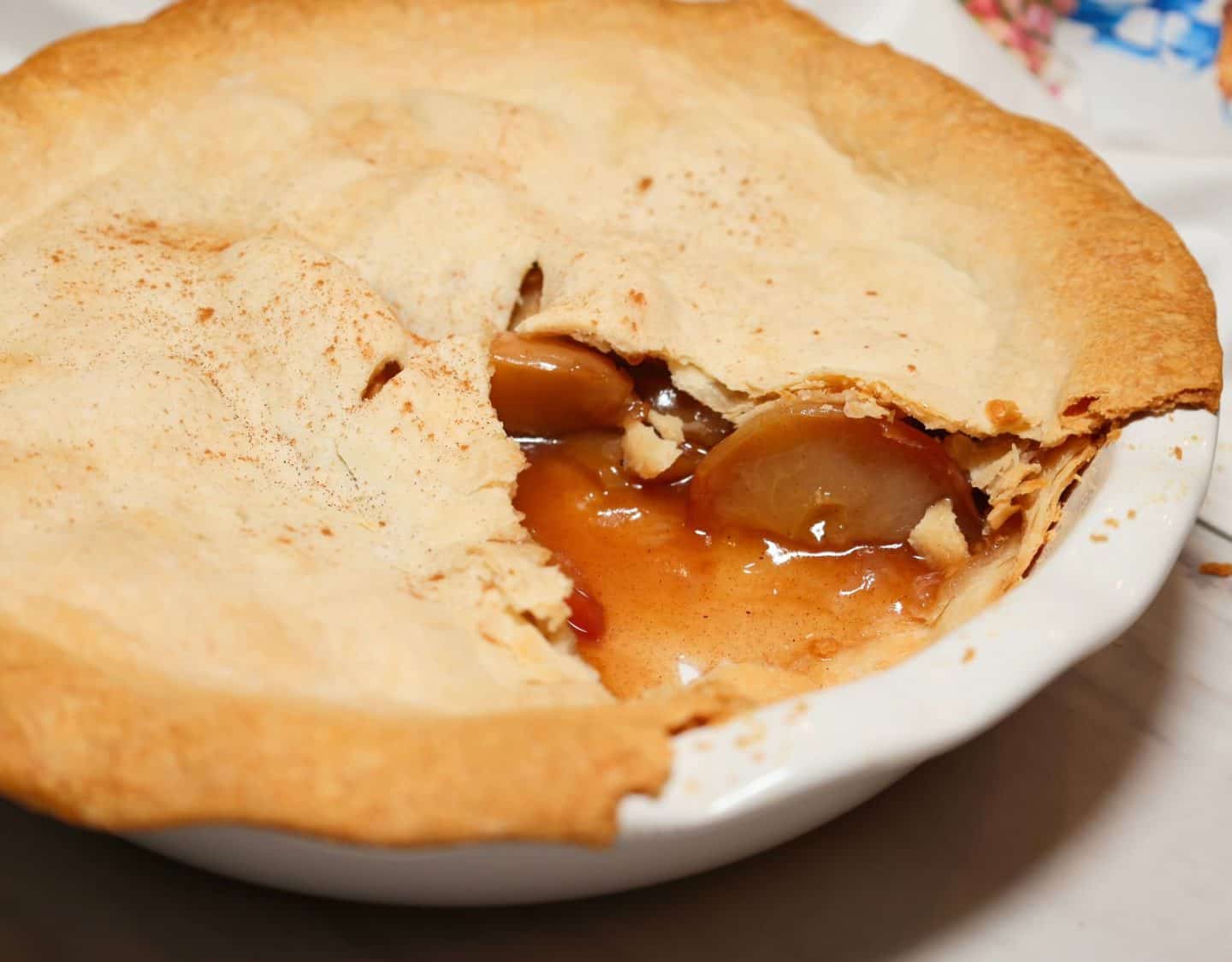 apple pie showing tender apple in a thickened filling