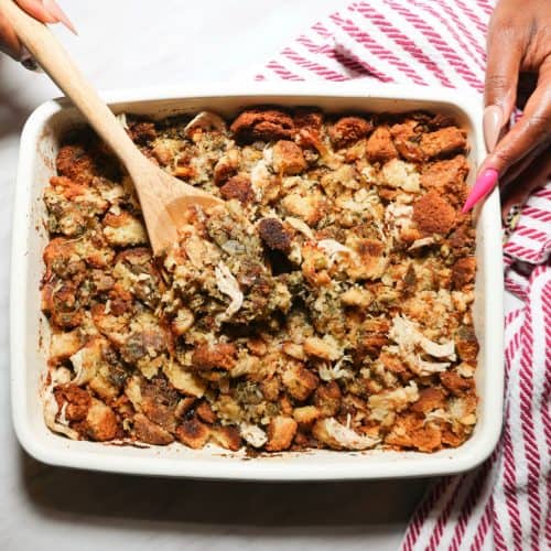 Moist Black folks chicken and dressing with golden cornbread piece