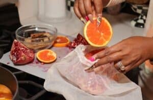 Adding orange to the strainer bag