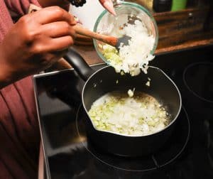 Butter with diced onion and celery in a saucepan