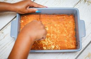 Cutting the cornbread into cubes
