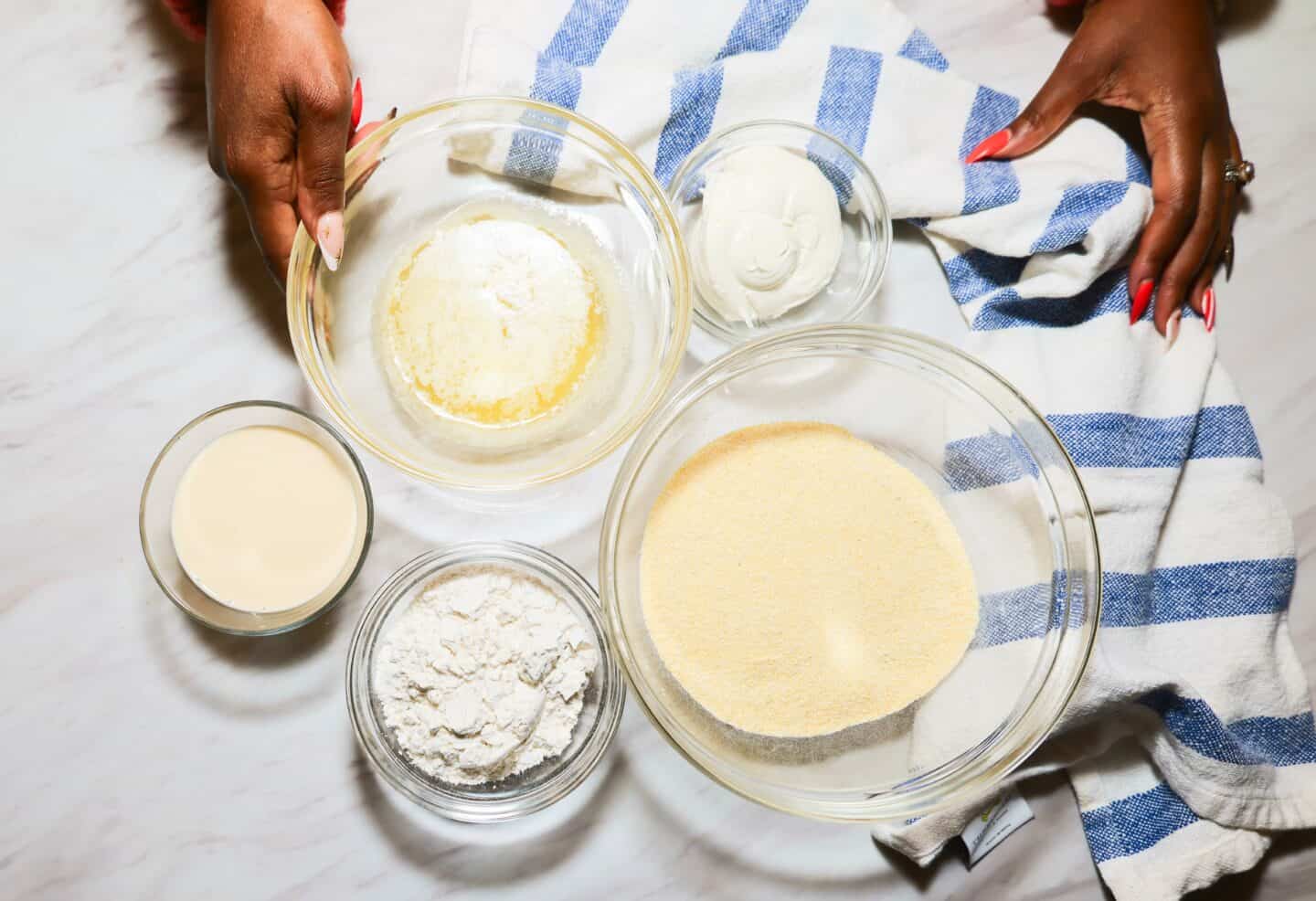 Ingredients for The Soul Food Pot® Southern soul food cornbread, including yellow cornmeal, flour, heavy whipping cream, whipped cream cheese, and melted butter.