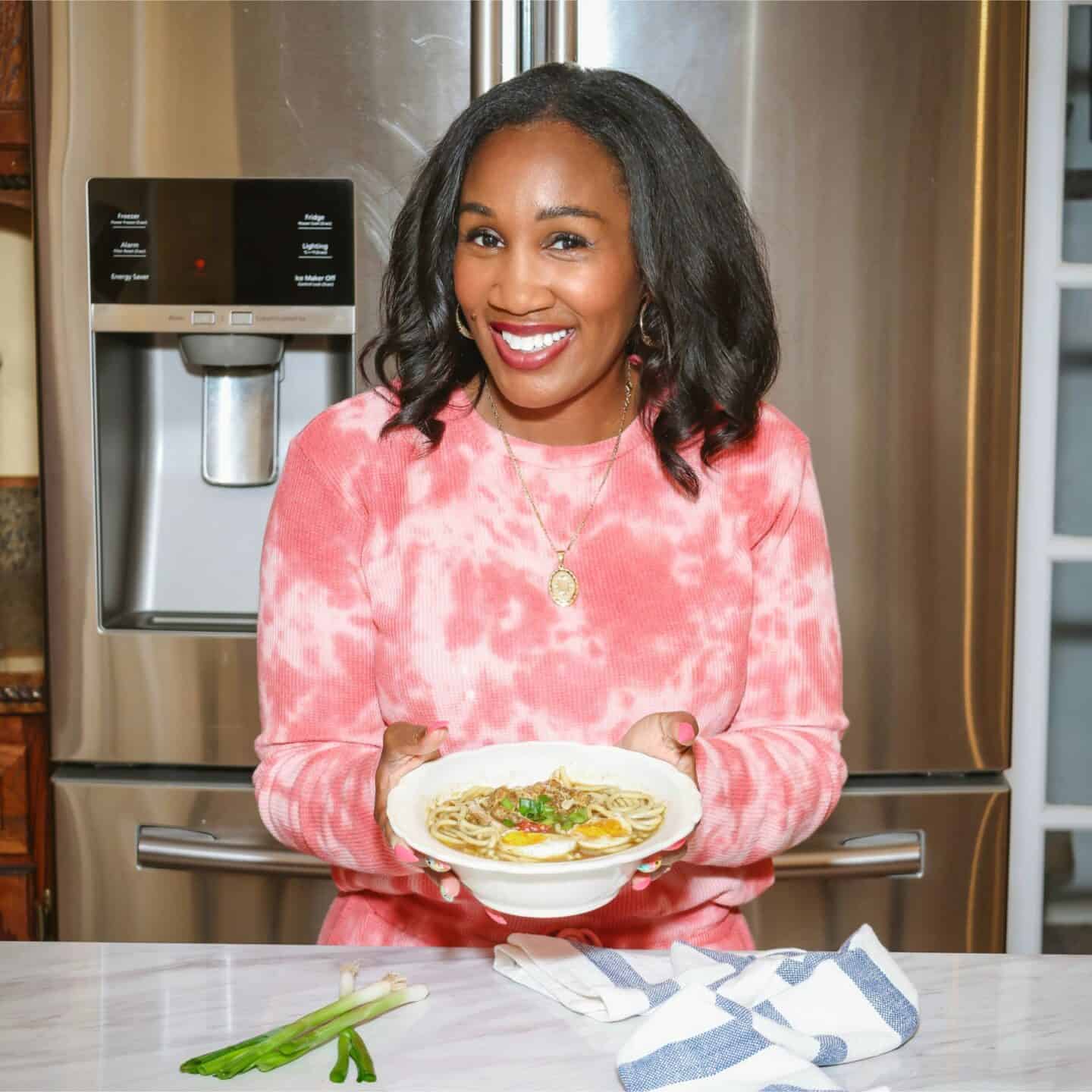 Tidewater native Shaunda Necole holding her homemade chicken yock, a regional Virginia food tradition she grew up with and continues through The Soul Food Pot®.